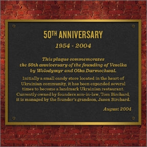 Black and gold plaque celebrating Veselka's 50th anniversary 