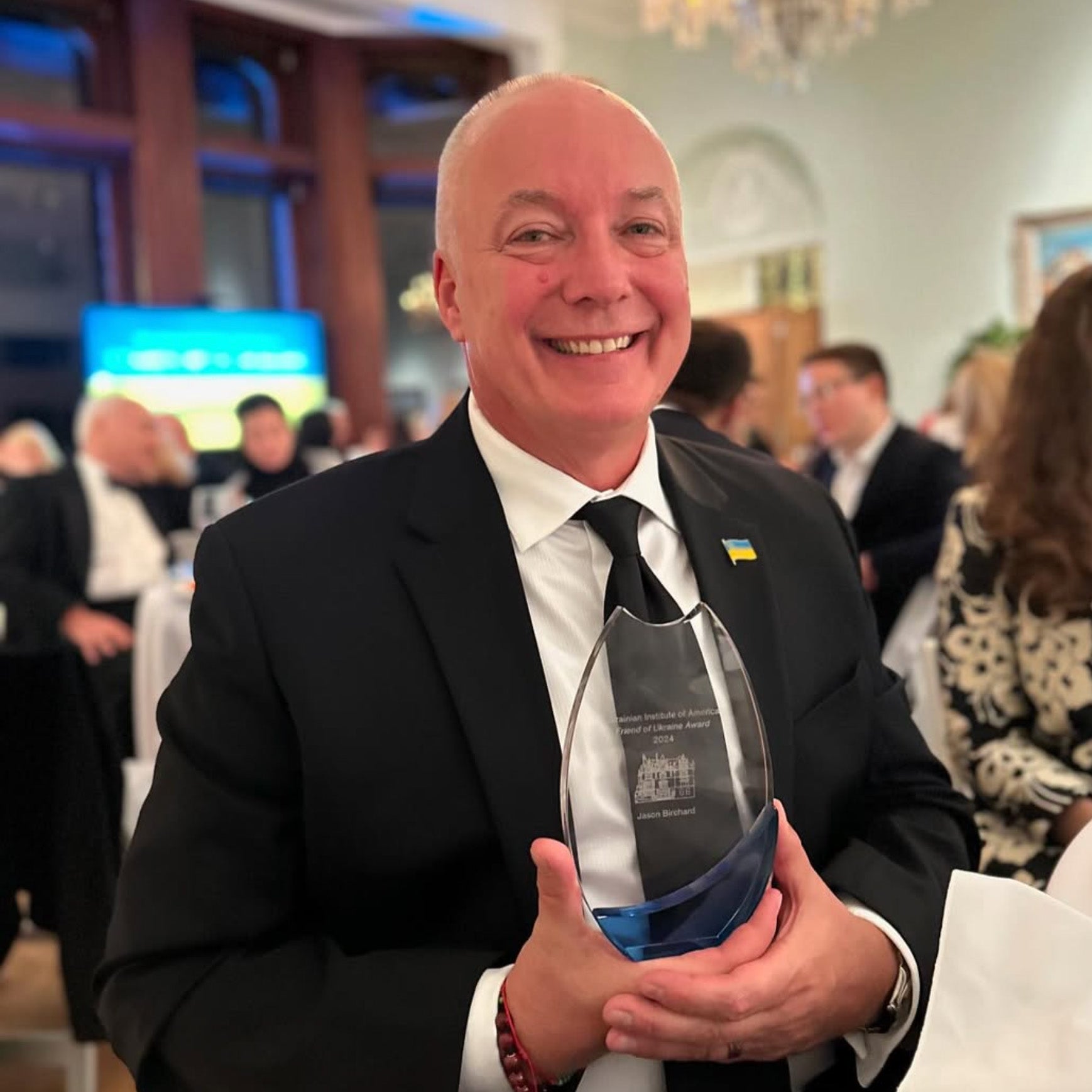 Jason Birchart with Friends of Ukraine award