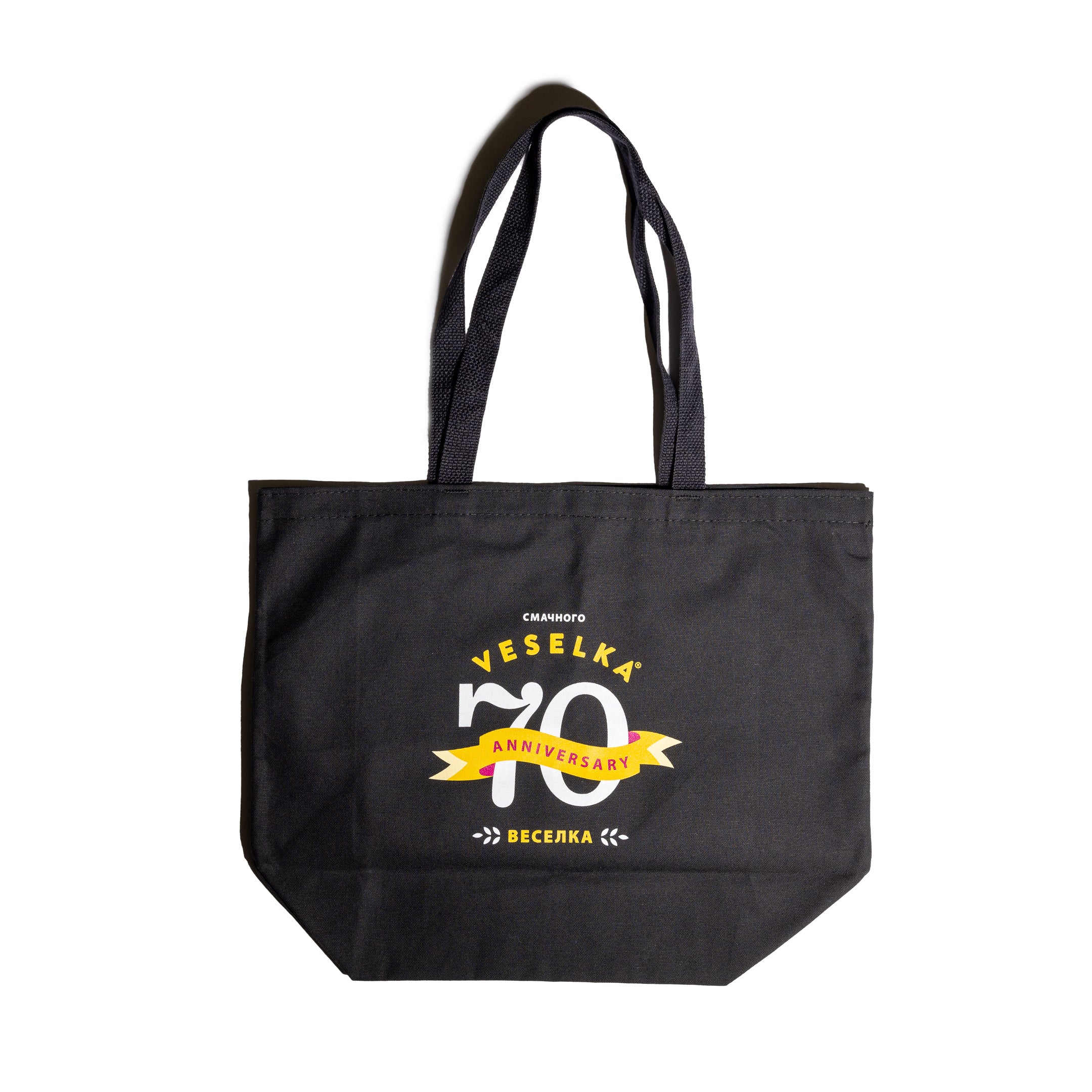 70th anniversary logo on black tote