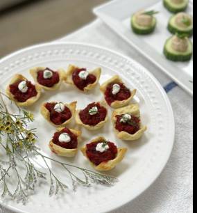 Beet based appetizer on a ornate white plate 