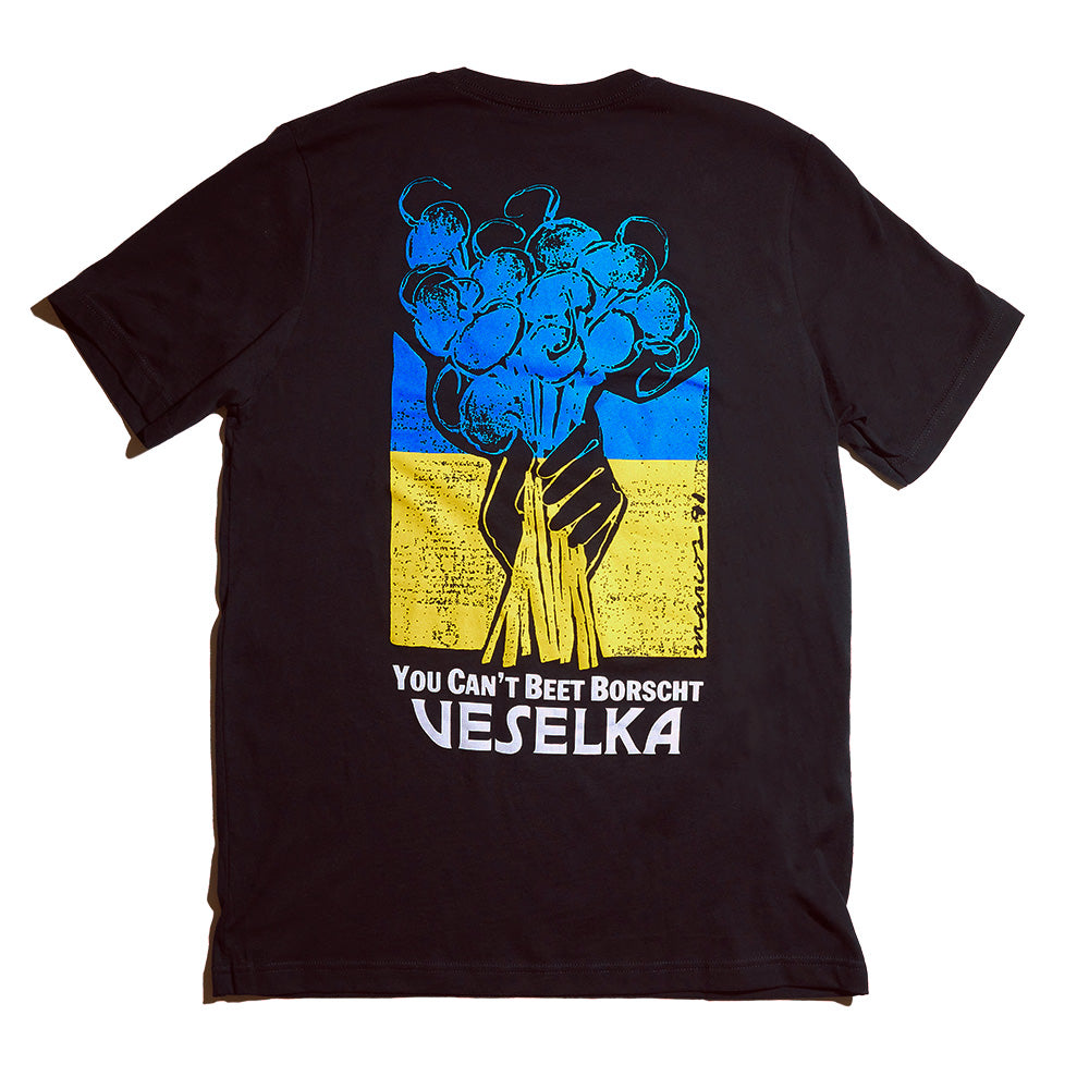 Black t-shirt back side with illustration hand holding a bunch of beets in Ukrainian colors. Phrase on the bottom says "You cant Beet Borscht , Veselka" 