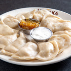 More pierogi on a plate boiled - Finals care package