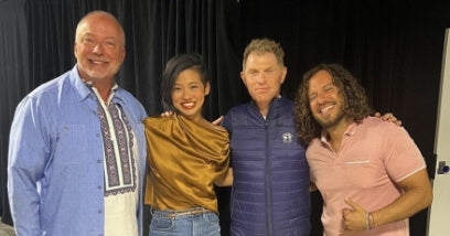 Jason posing with Bobby Flay and other judges for Bobby Flays show 