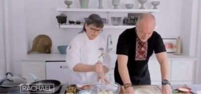 Jason and Olesia filming a bit for Rachel Ray in a white kitchen 