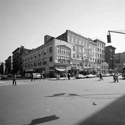 Veselka old school black and white with pedestrians walking in the street 