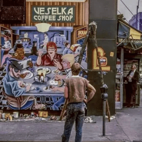 Arnie the muralist working on an outdoor mural for Veselka, vintage, Mural is of people eating and drinking in the Veselka dining room. 