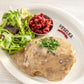 Stuffed Cabbage covered in gravy with small side salad 